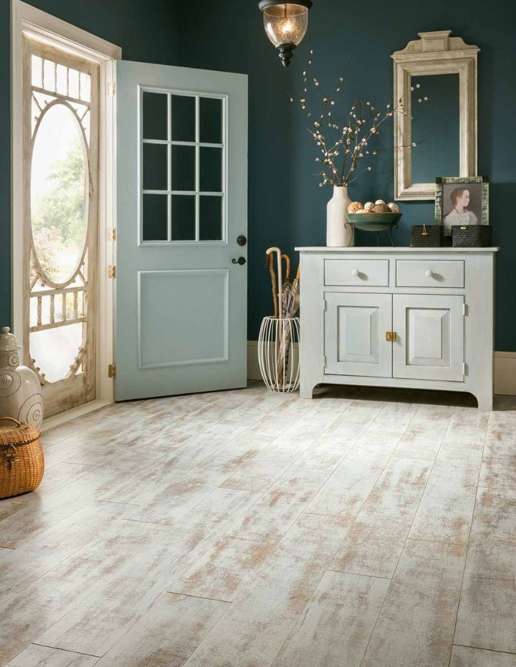 distressed wood look laminate floors in an entryway