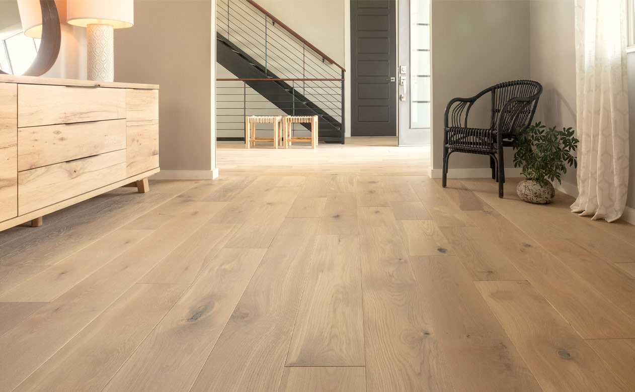 warm toned hardwood flooring in hallway.