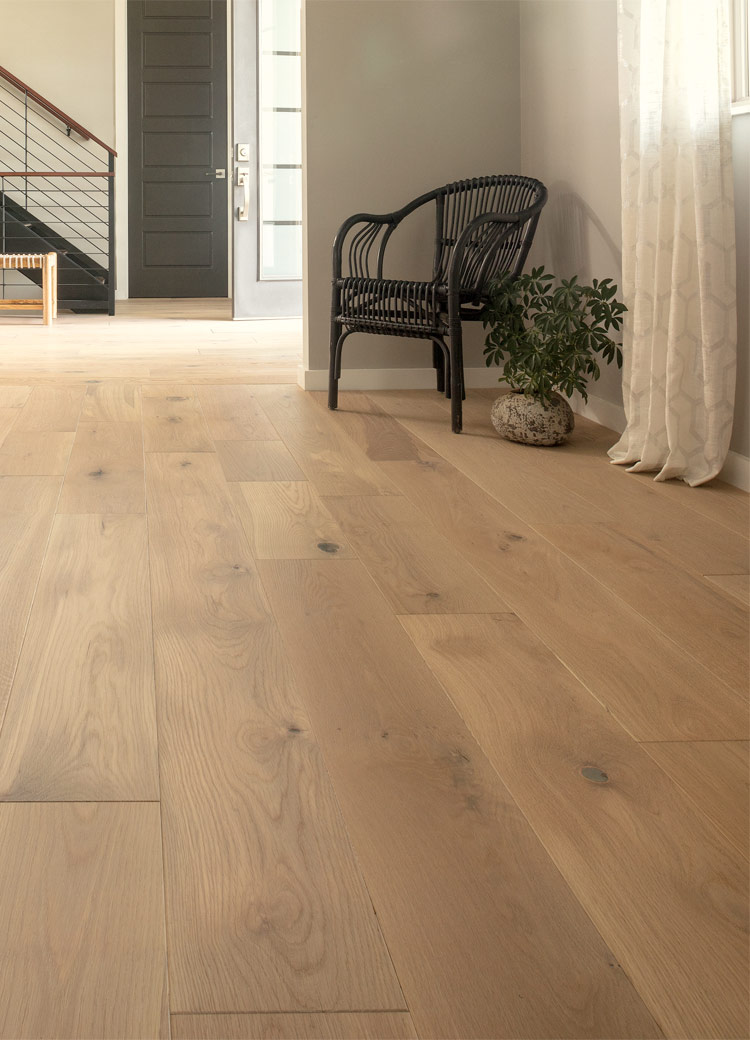 warm toned hardwood flooring in hallway.